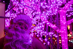 Santa Claus and pink Christmas lights decorate the Pink Christmas market in Munich Germany