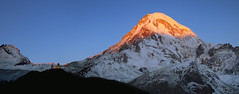 Golden peak of Kazbek (5054m) at first light of dawn