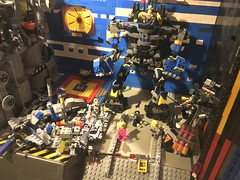 LEGO Classic Space: The hybrid tech-prodigy inventor Cray buys a Giga-size Robotic machine exo-suit second-hand at Harry’s junkyard that runs amok at the rebel base HQ ( AFOL sci-fi moc with robot and minifigures ) toy hobby photography model build