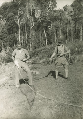 Alan Groom and his brother John with a carpet python, Binna Burra