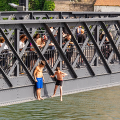 A leap of faith - Onlooker look at boys jumping from The Dom Luís I Bridge - Porto, Portugal