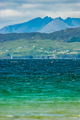 Sound of Sleat, Sleat Peninsula and Black Cuillins of Skye from the legendary Camusdarach Beach, Lochaber,  Inverness-shire, Scotland.