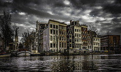 Buildings along the Amstel Canal with Zuiderkerk church in the distance.  552a