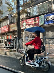 moped with screen & roof in Leshan, China