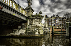 Artwork on Blauwbrug bridge over canal in Amsterdam.  573a