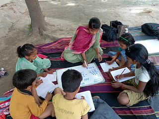 Blue Pen’s volunteer Shama taught (Addition )to 3rd grade students at Nithari slums